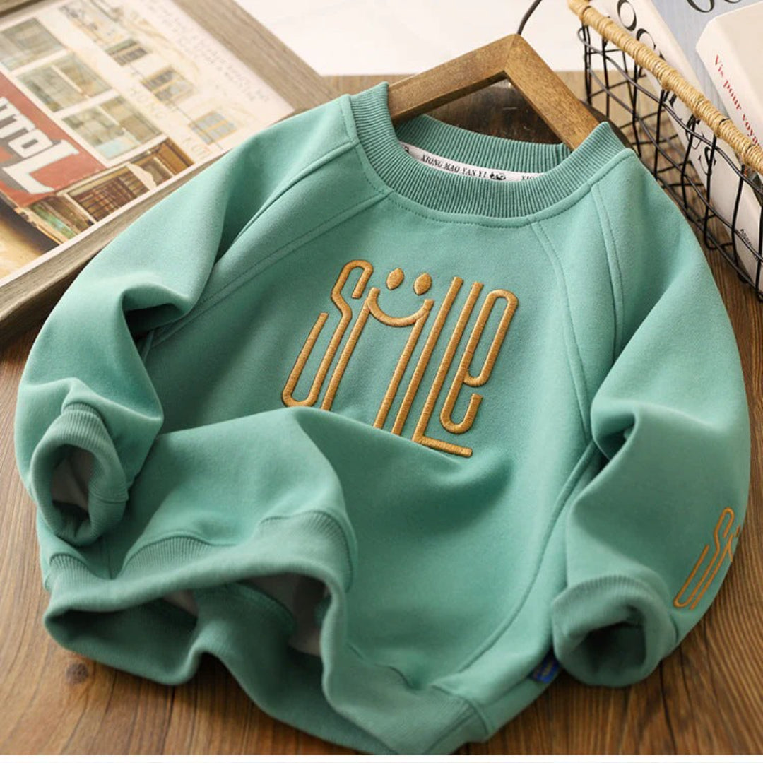 Unisex Kinderpullover mit einem fröhlichen Smile-Design