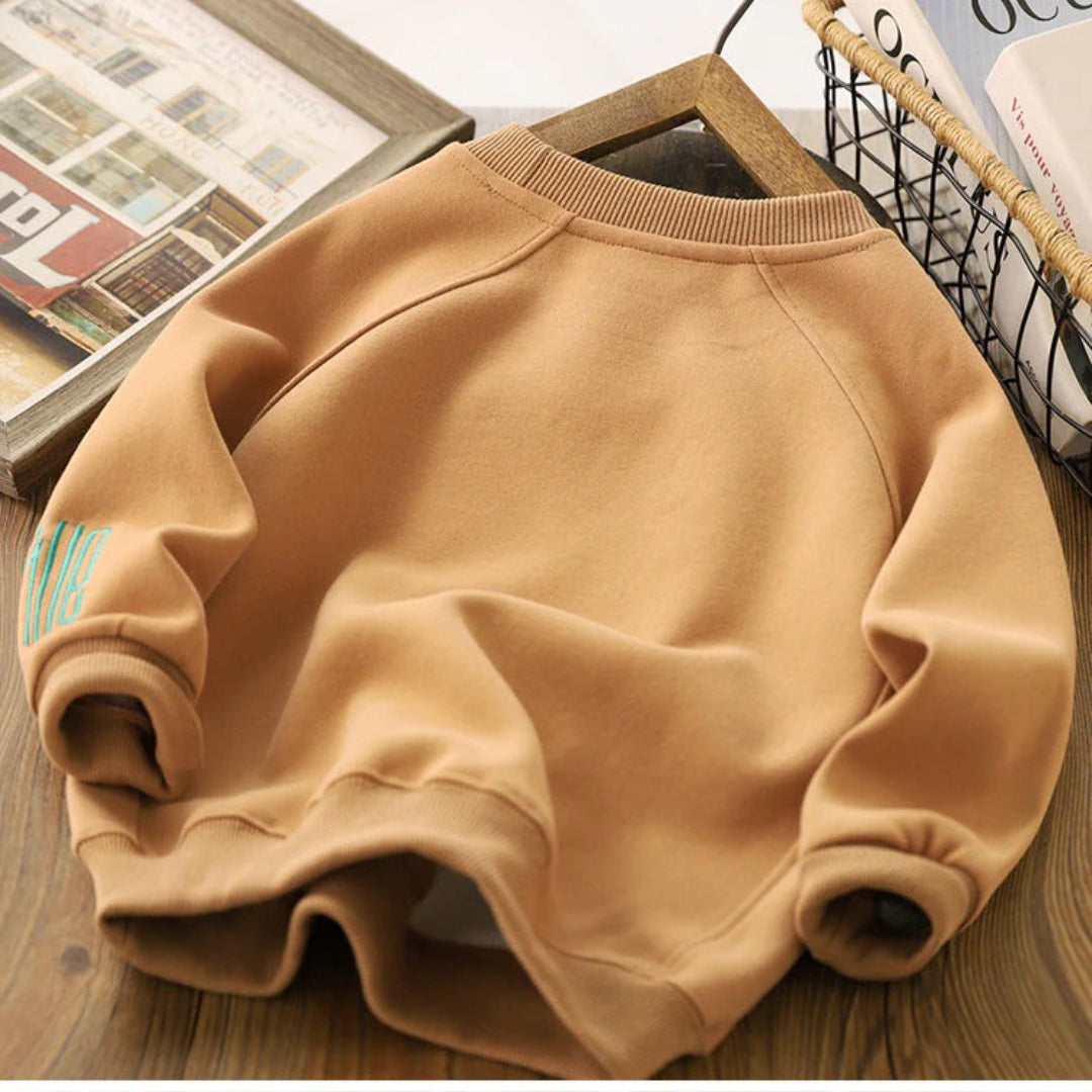 Unisex Kinderpullover mit einem fröhlichen Smile-Design